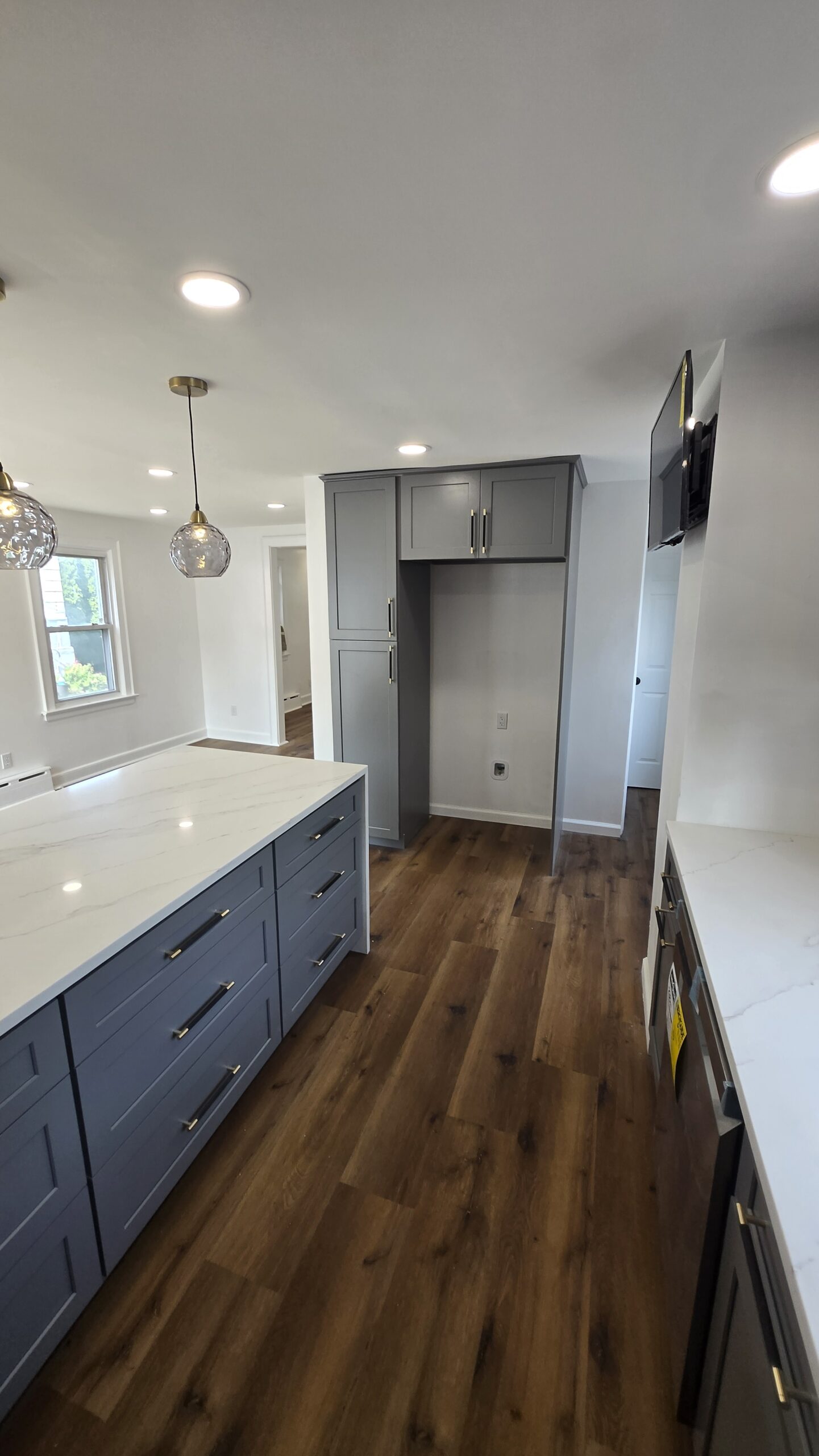 Renovated kitchen with open layout and soft lighting