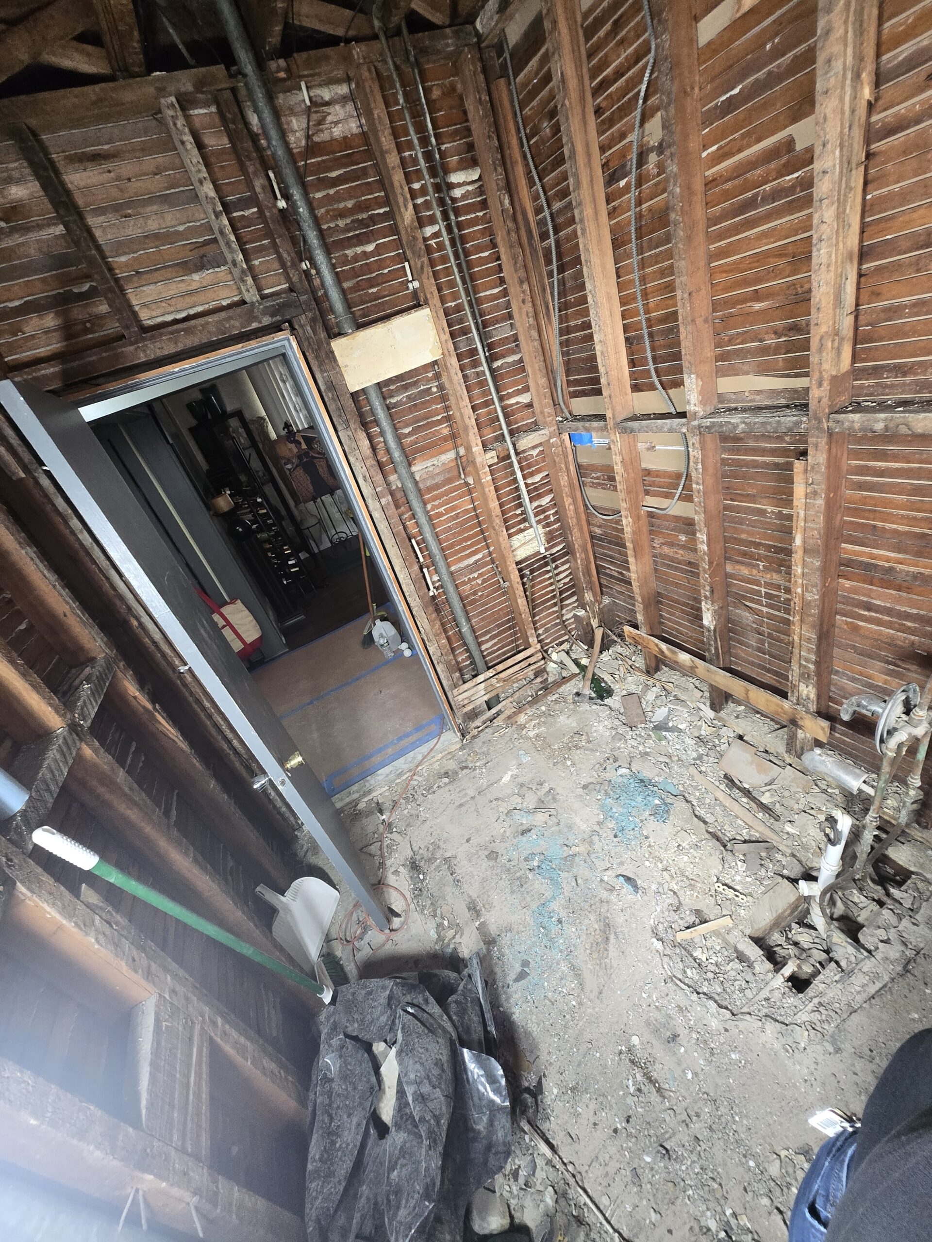 In-progress renovation showing framing and rough construction