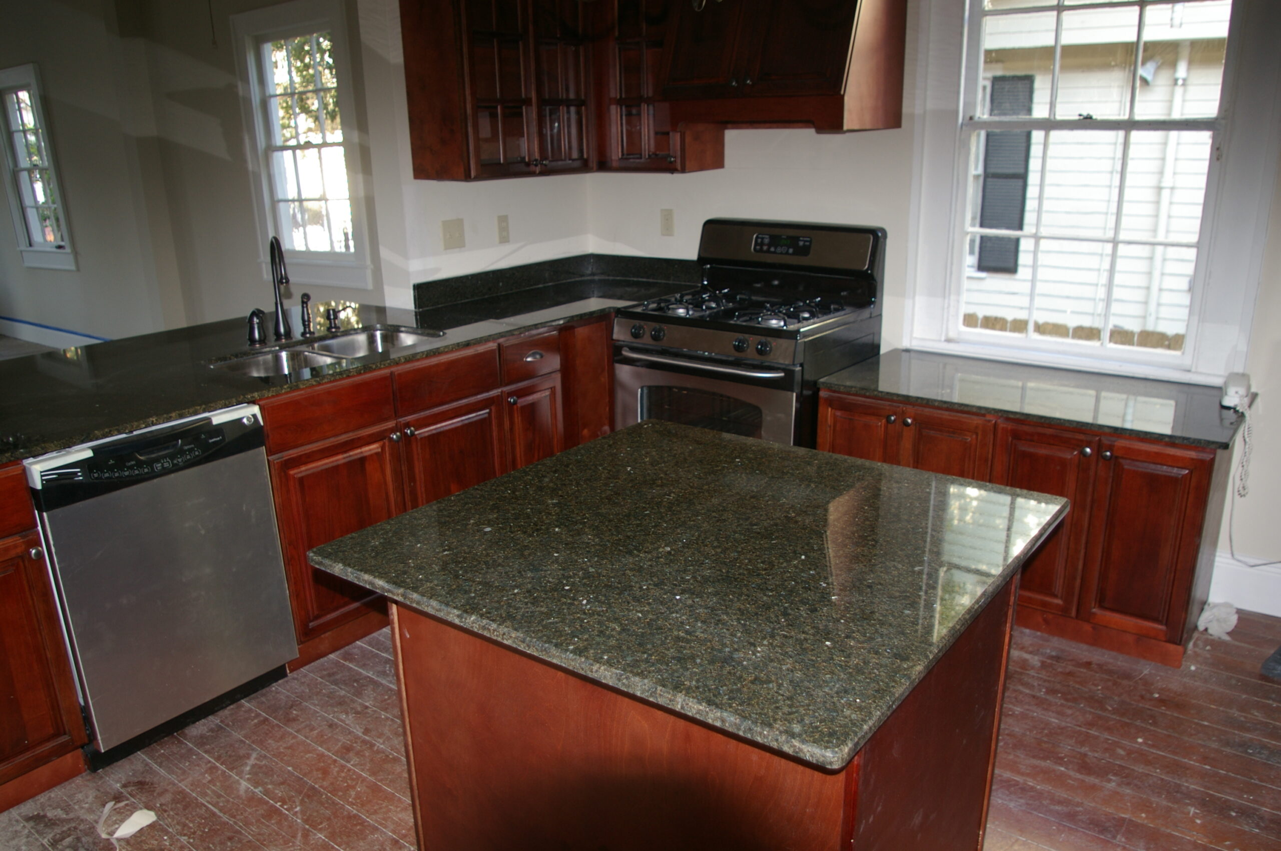 Bright kitchen renovation with wood floors and modern finishes